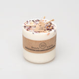 Candle with a decorative top and 'Beauty Scents' label on a white background