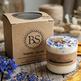 Beauty Scents Medium Candle With Wild Flowers Angle view on the wooden table