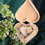 Handmade heart candle decorated with blackberries, set in rustic wooden box