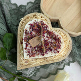 Handmade heart candle decorated with rose petals, set in rustic wooden box