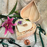 Detailed view of wooden heart box and blueberry candle, perfect gift